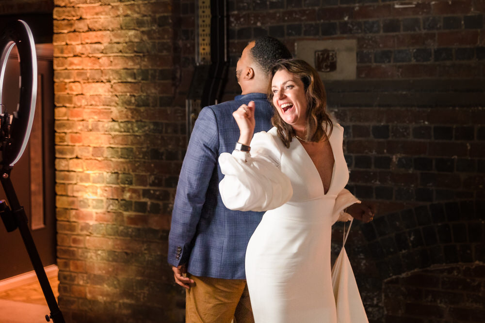 Wedding guests enjoying a 360 photo booth experience at a Birmingham reception