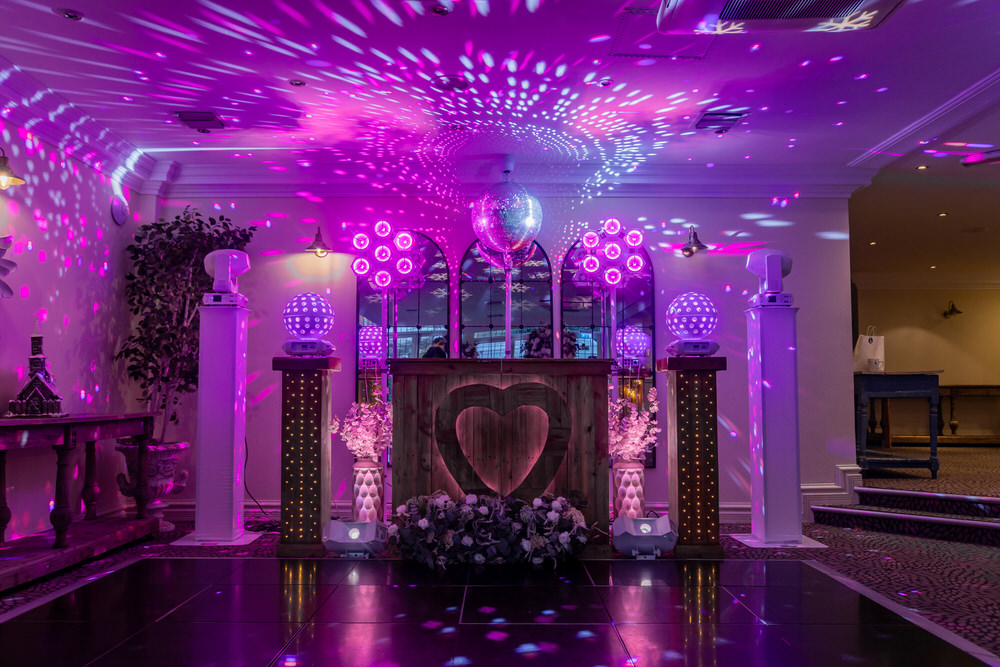 Blue Diamond Entertainment DJ booth with heart design, disco balls and professional mirror ball at Hogarths Stone Manor Garden Room