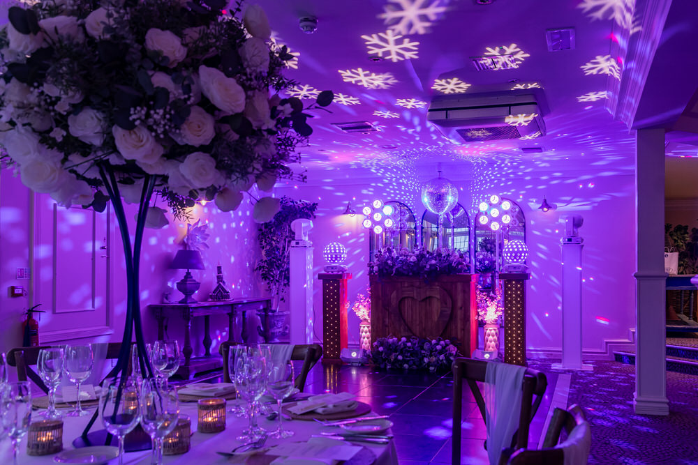 Blue Diamond Entertainment full lighting production transforming the Garden Room at Hogarths Stone Manor, Kidderminster, with purple uplighting and moving heads