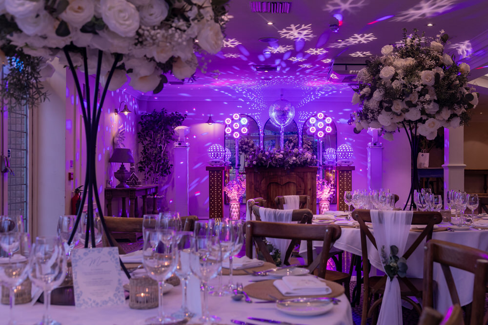 The Diamond package in action at Hogarths Stone Manor, Worcestershire, with purple uplighting, snowflake projections and fully dressed Garden Room